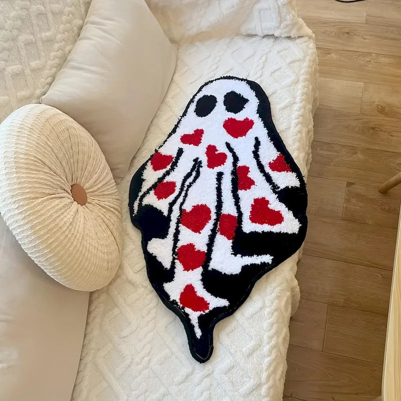 Ghost Heart Tufted Rug — "Lovestruck Ghost"
A whimsical ghost-shaped tufted rug covered in scattered red hearts, blending spooky-cute charm with a playful pop of color. The plush, textured pile gives it a cozy handcrafted-l