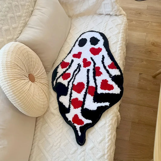 Ghost Heart Tufted Rug — "Lovestruck Ghost"
A whimsical ghost-shaped tufted rug covered in scattered red hearts, blending spooky-cute charm with a playful pop of color. The plush, textured pile gives it a cozy handcrafted-l