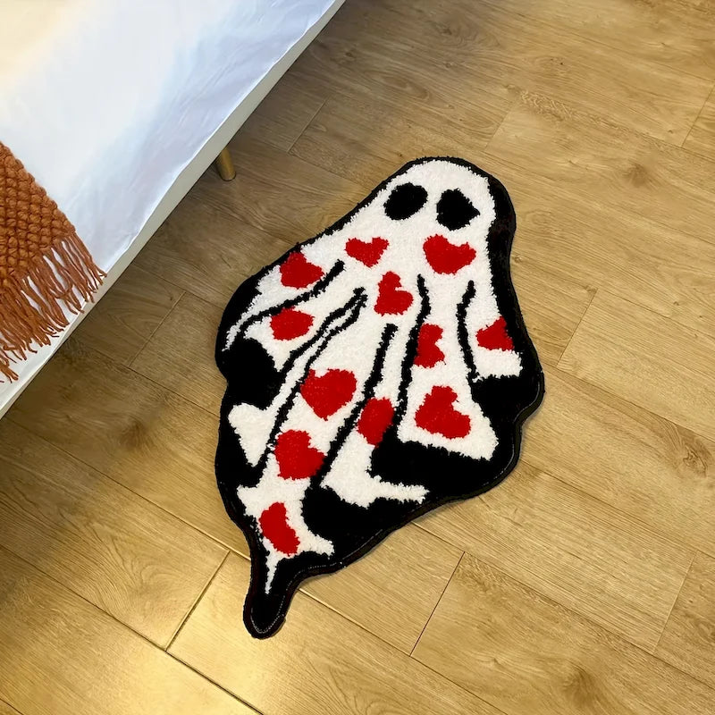 Ghost Heart Tufted Rug — "Lovestruck Ghost"
A whimsical ghost-shaped tufted rug covered in scattered red hearts, blending spooky-cute charm with a playful pop of color. The plush, textured pile gives it a cozy handcrafted-l