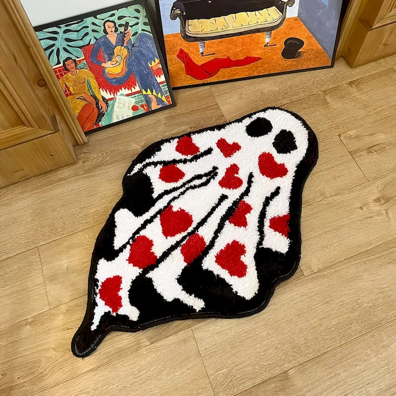 Ghost Heart Tufted Rug — "Lovestruck Ghost"
A whimsical ghost-shaped tufted rug covered in scattered red hearts, blending spooky-cute charm with a playful pop of color. The plush, textured pile gives it a cozy handcrafted-l