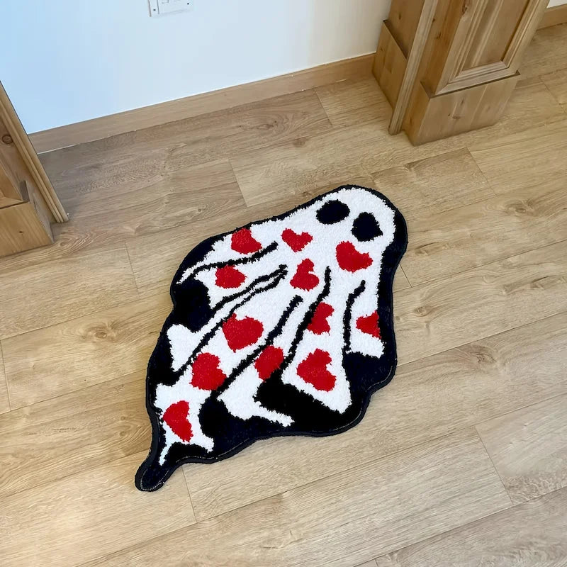 Ghost Heart Tufted Rug — "Lovestruck Ghost"
A whimsical ghost-shaped tufted rug covered in scattered red hearts, blending spooky-cute charm with a playful pop of color. The plush, textured pile gives it a cozy handcrafted-l